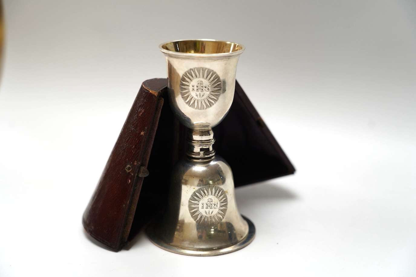 A cased late William IV silver communion chalice and patten, by Joseph & John Angell, London, 1836 (lacking locking piece?). Condition - poor